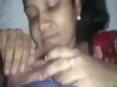 Before swallowing wang, a kinky, sedentary Indian woman with black hair exposed her love melons.
